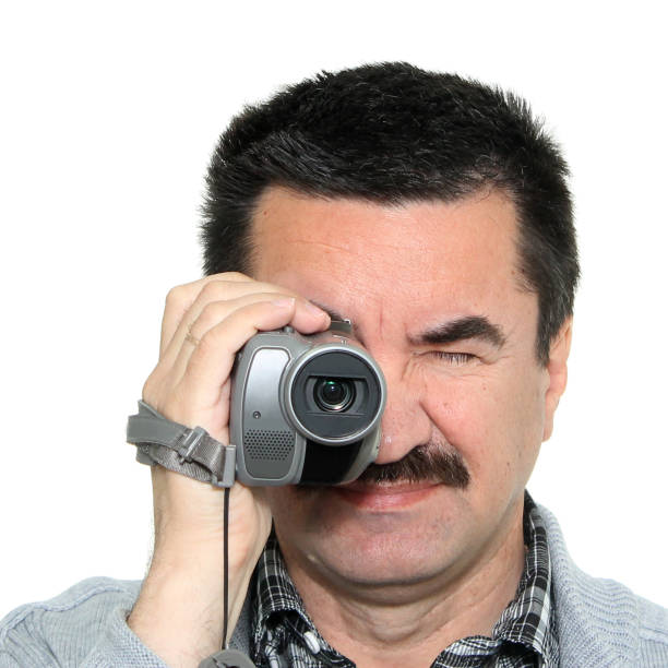 istock Portrait of a man with a video camera 811563786