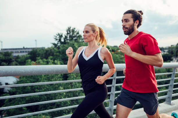 istock Woman Exercising With Personal Trainer Outdoors 811584806