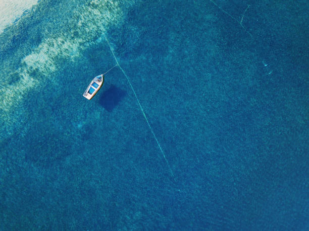 Aearial vliew to a lonely boat anchored in the sea