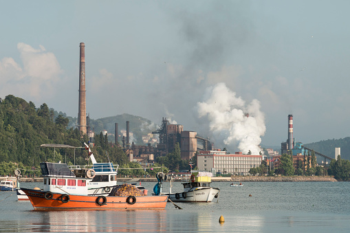 Zonguldak eregli district, fishing boats and erdemir iron and steel factory behind