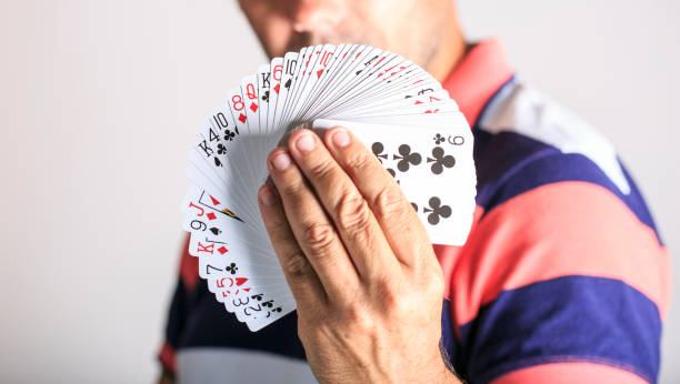 istock Man showing playing card in his hand 811620396