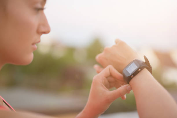 istock Girl looking at sport watch 811625564