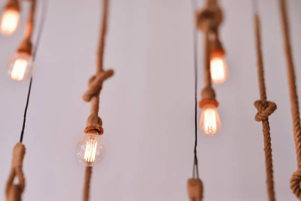 istock Electric lamp hanging on a rope 811632986