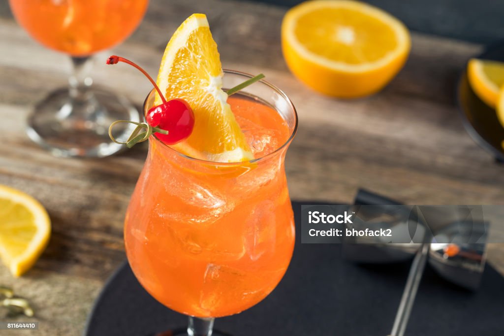 Cold Refreshing Singapore Sling Cocktail Cold Refreshing Singapore Sling Cocktail with Rum and Pineapple Arm Sling Stock Photo