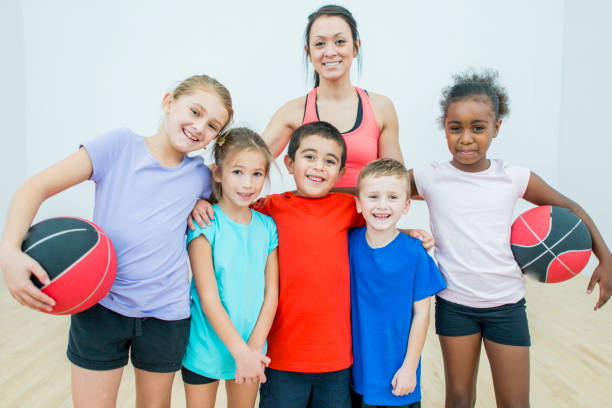 istock Schoolchildren With Their Gym Teacher 811654086