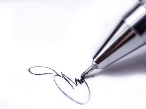istock Sign a white paper with pencil 811656846