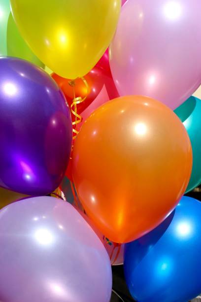 istock Pink, orange and purple balloons 811672258
