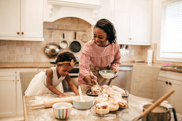 istock Mom and toddler baking together 811681824