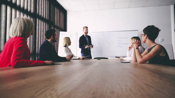 istock Business man presenting new ideas and projects to his team 811681966