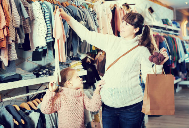 istock Shopping in the store children's clothes 811699952