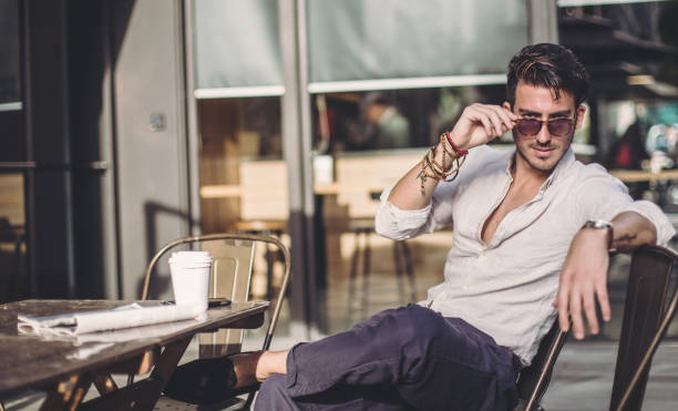 istock Portrait of a man relaxing in cafe 811706982