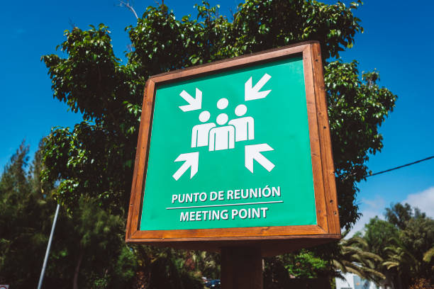 istock Assembly point in english and spanish language 811707046