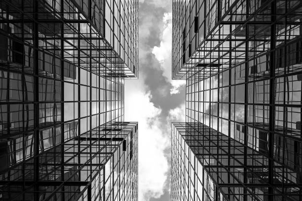 Symmetrical mirrored office buildings Symmetrical mirrored office buildings black and white architecture stock pictures, royalty-free photos & images