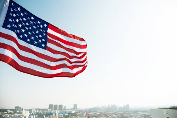 istock Waving American flag and building 811730734