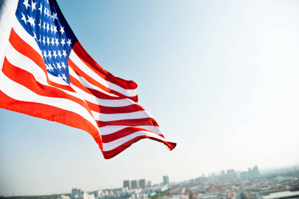 istock Waving American flag and building 811730762