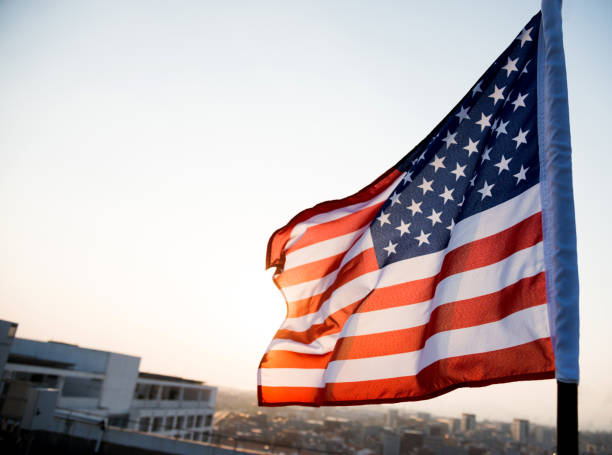 American flag waving in sunset