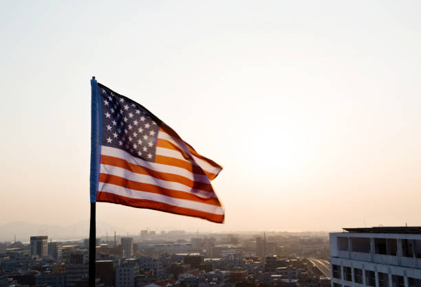 istock American flag waving in sunset 811730830