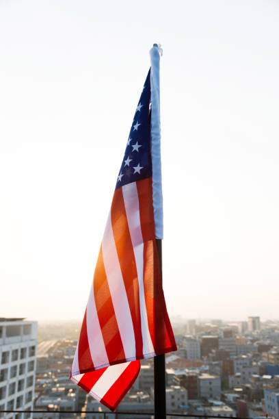 istock American flag waving in sunset 811730832