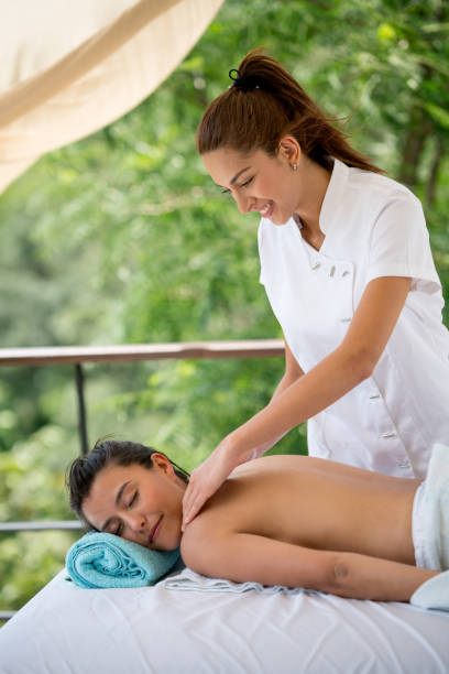 istock Woman getting a back massage at an outdoors spa 811733520