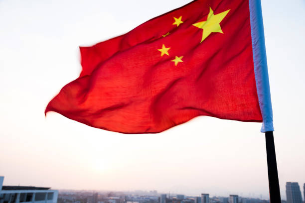 istock China flag waving in sunset 811738500