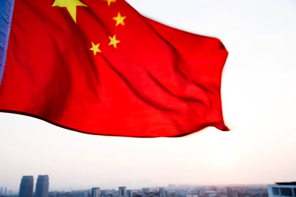 istock China flag waving in sunset 811738520