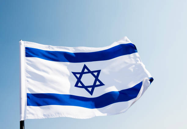 istock Israel's national flag in the wind 811752788