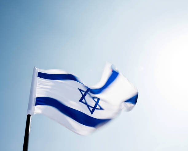 istock Israel's national flag in the wind 811752814