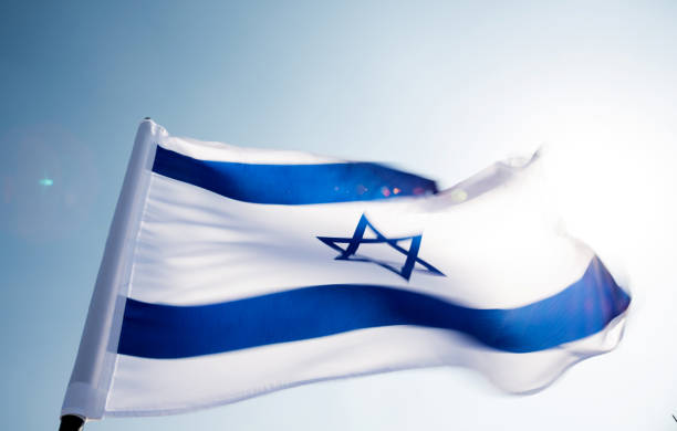 istock Israel's national flag in the wind 811752816