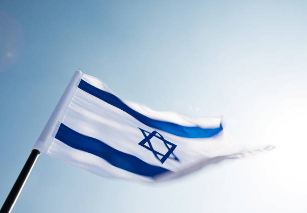 istock Israel's national flag in the wind 811752818