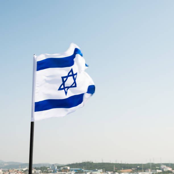 istock Israel's national flag in the wind 811752838