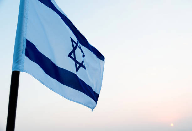 istock Israel's national flag in the wind 811752872