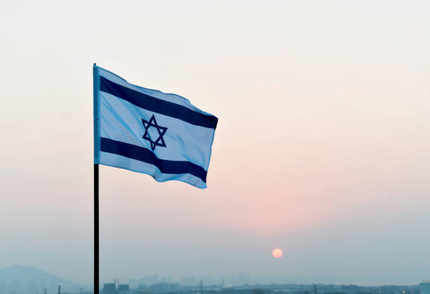 istock Israel's national flag in the wind 811752910