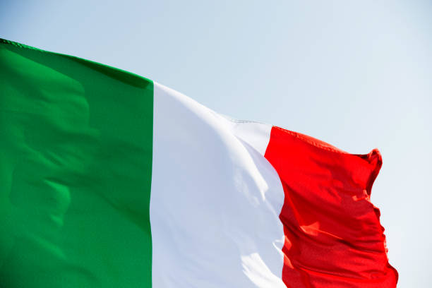 istock Italian flag waving in the sky 811755026