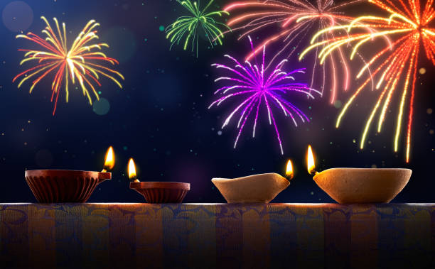 Diwali celebration with diya lamps and fireworks Diwali celebration with diya lamps and fireworks clay oil lamp stock pictures, royalty-free photos & images