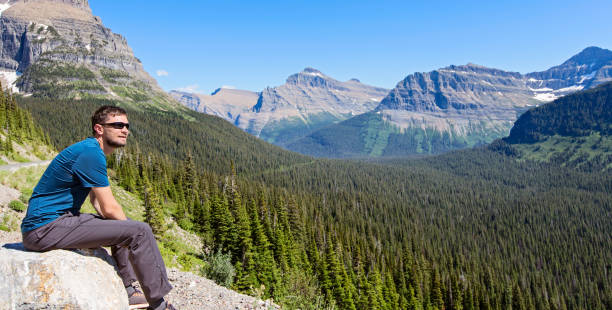 istock man enjoying mountains in glacier national park 811767466