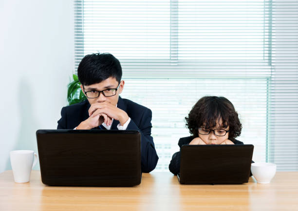 istock Father and son working in the office 811767518