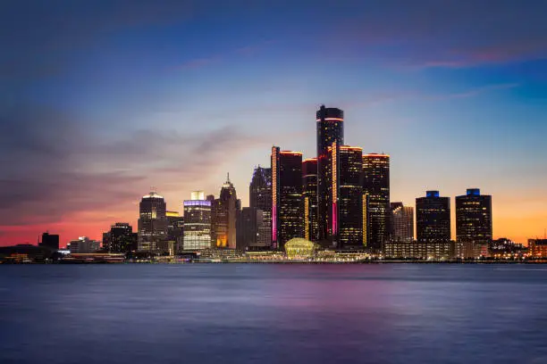 A cityscape of Detroit, Michigan at dusk.