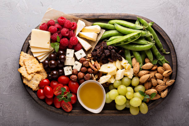 istock Cheese plate with fresh vegetables and fruits 811806008