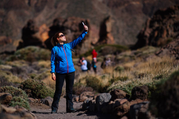 istock hiker woman taking a selfie 811808328