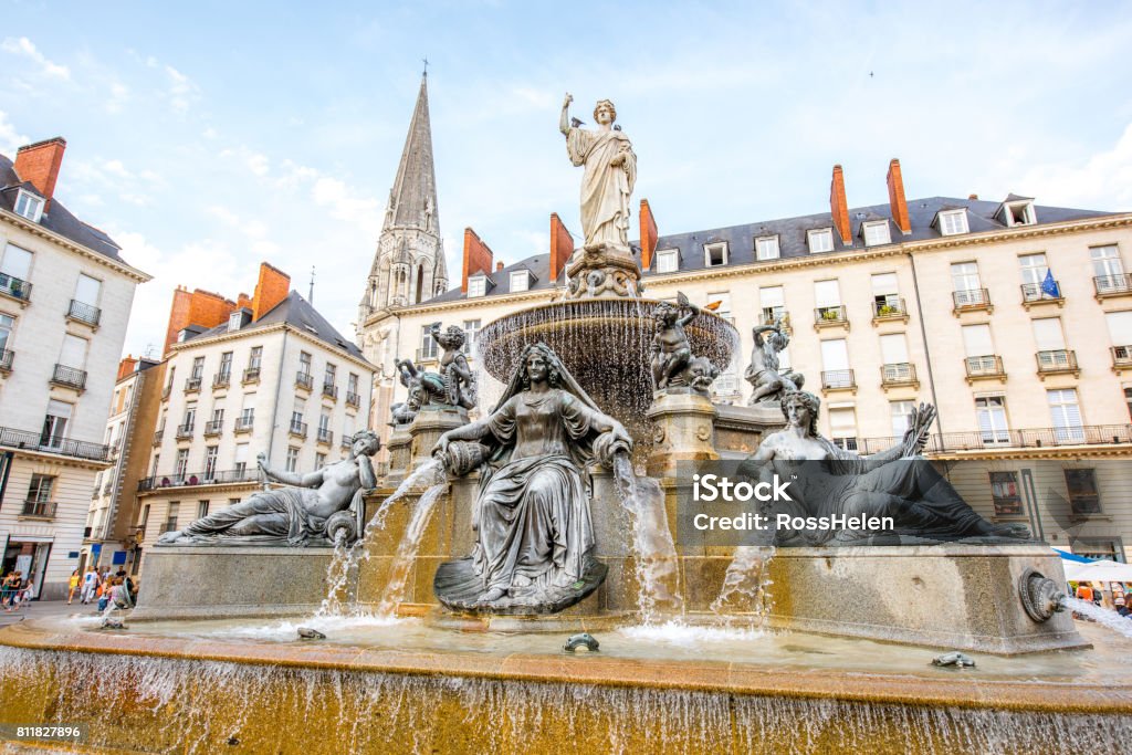 Nantes city in France View on the Royal square with fountain and church tower in Nantes city in France Nantes Stock Photo