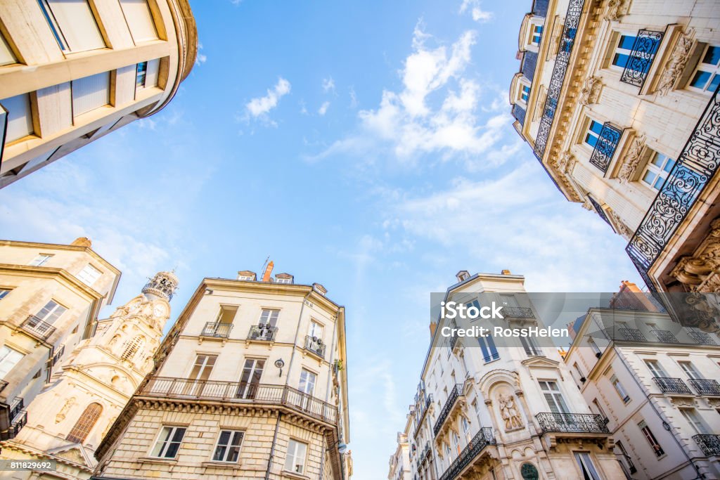 Nantes city in France Street view from below on the beautiful buildings and blue sky in Nantes city in France Nantes Stock Photo