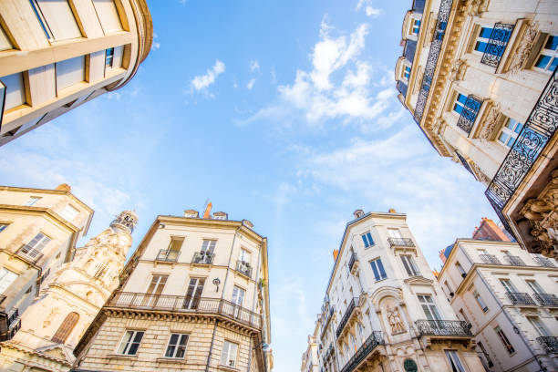 Nantes city in France Street view from below on the beautiful buildings and blue sky in Nantes city in France loire atlantique photos stock pictures, royalty-free photos & images