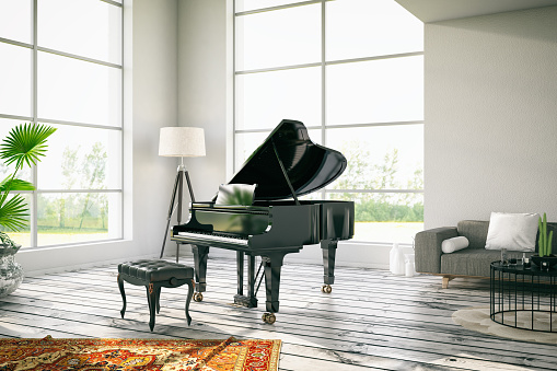 White loft interior with a black piano