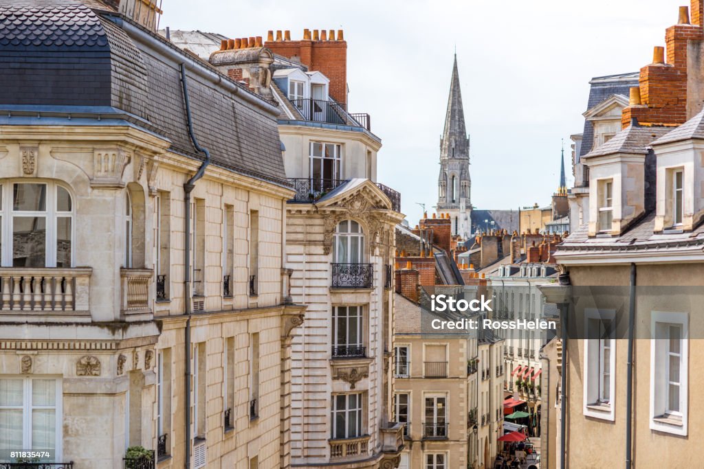 Nantes city in France Street view on the beautiful residential buildings andchurch tower in Nantes city during the sunny day in France Nantes Stock Photo