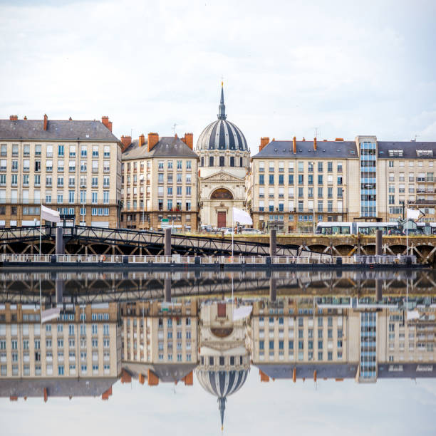 Nantes city in France Beautiful riverside view with old buildings and Notre Dame cathedral in Nantes city in France loire valley photos stock pictures, royalty-free photos & images