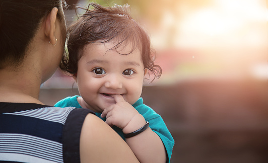 Young Indian Mother with her Loving Baby Girl Daughter