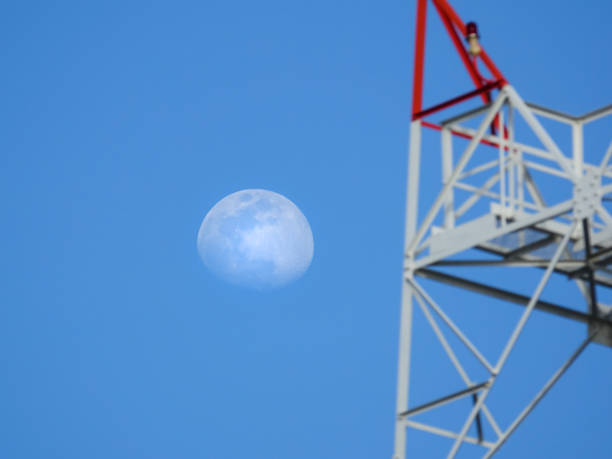 istock moon and communication pole on blue sky on day 811849712