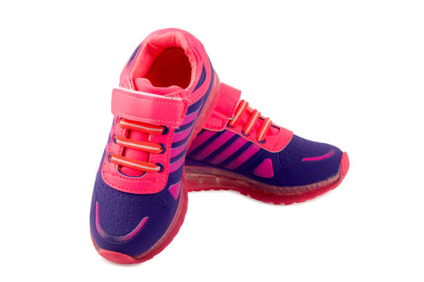 istock Blue and pink children's sneakers isolated on a white 811853292