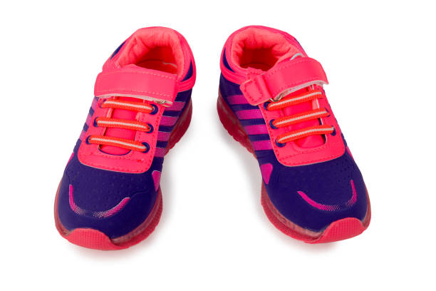 istock Blue and pink children's sneakers isolated on a white 811853306