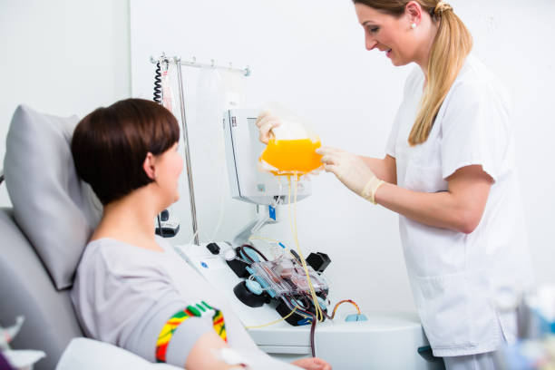 Nurse showing patient donating own blood her blood plasm Nurse showing patient donating own blood in hospital her blood plasm blood plasma stock pictures, royalty-free photos & images